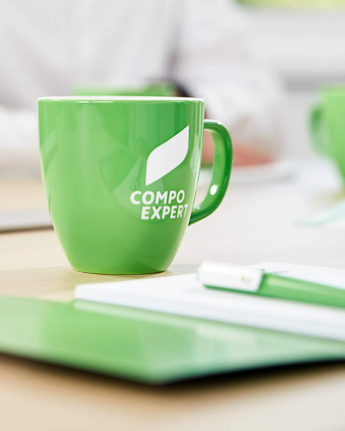 close up of COMPO EXPERT employee working on a desk